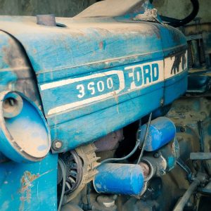 a close up of an old blue tractor